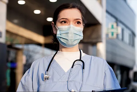 A nurse wearing a mask